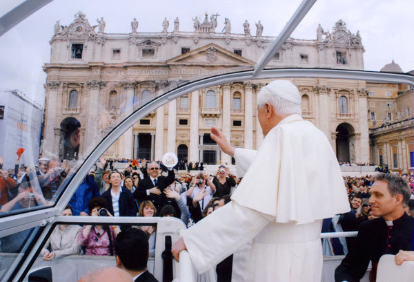 The Pope waves to the crowd The Pope waves to the crowd