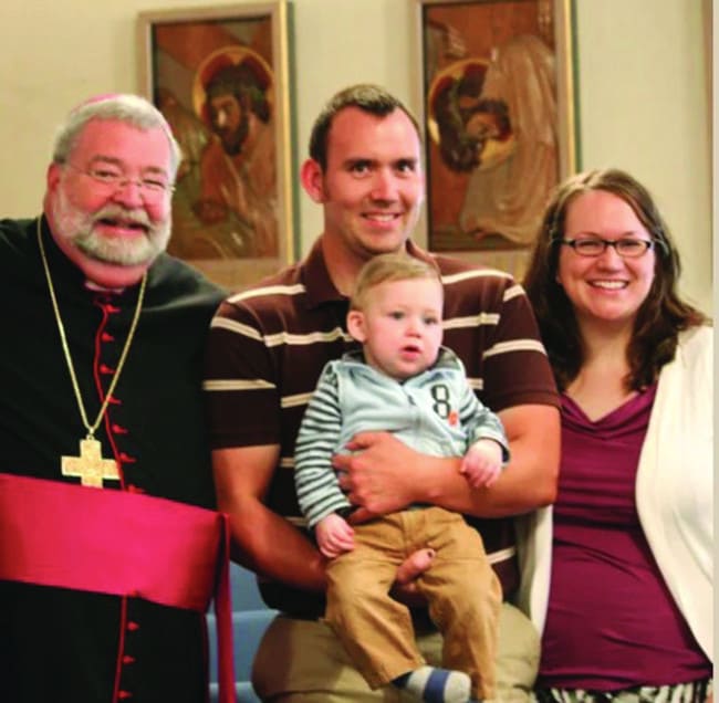 James Fulton with his parents and Bishop Jenky